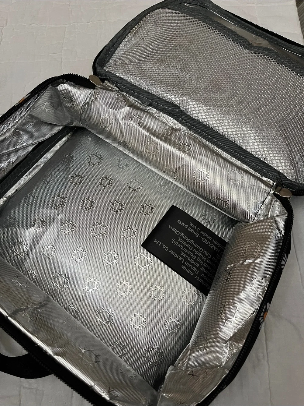 Black Daisy Print Backpack and insulated lunch bag.